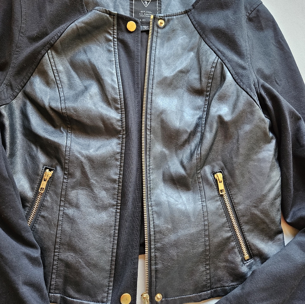 Women's leather coat size medium..color is black ...guess black leather coat